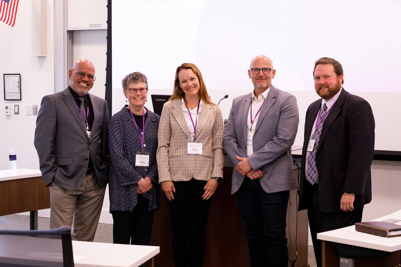 Presenters gathered after a symposium session