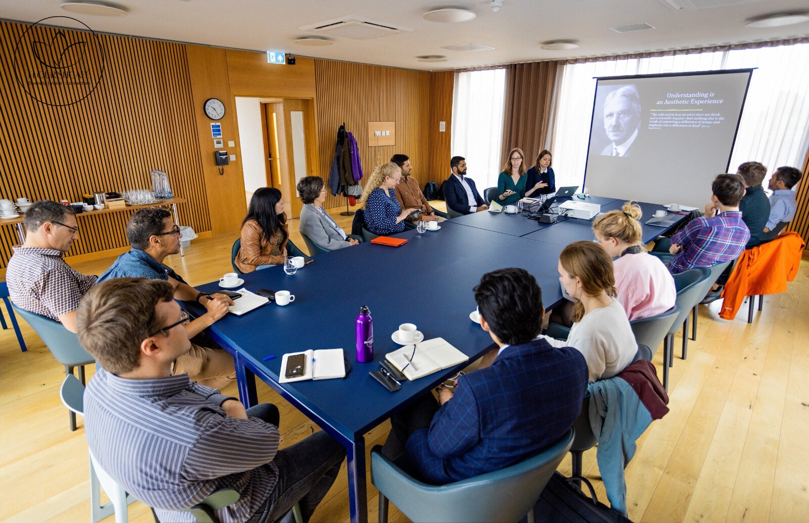 Researchers gathered around a conference table for a project workshop