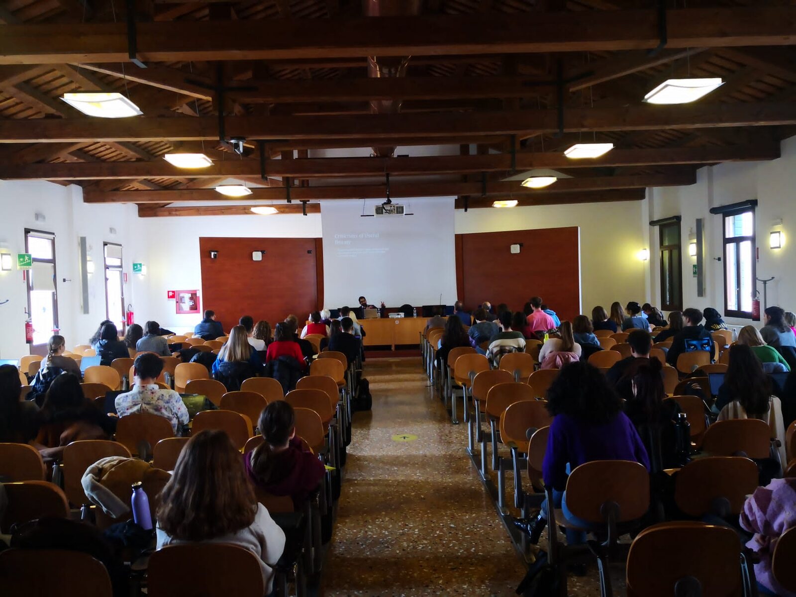 An audience seated for a project presentation